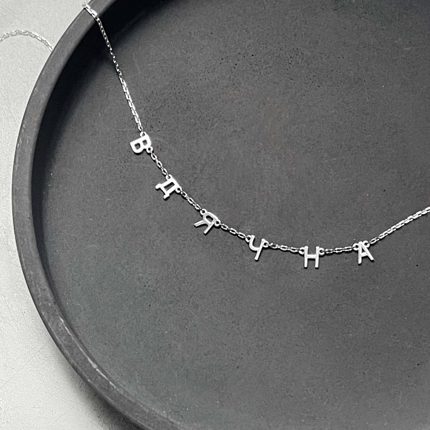 Necklace with a custom word