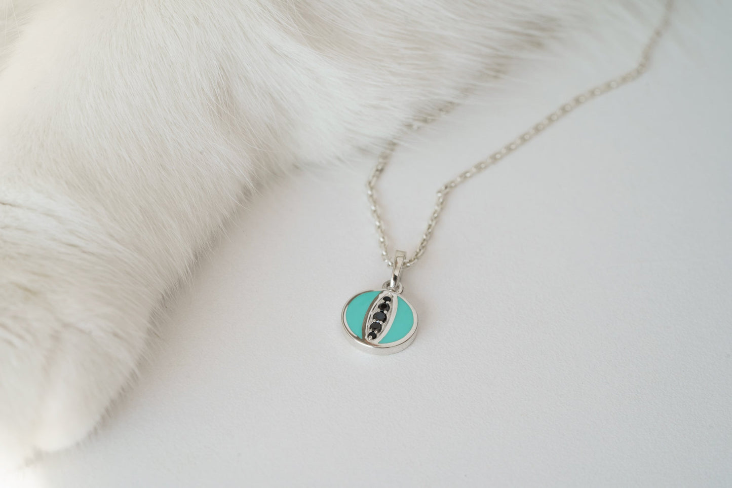 Pendant "Cat's Eye" (9 mm) with emerald enamel and black stones