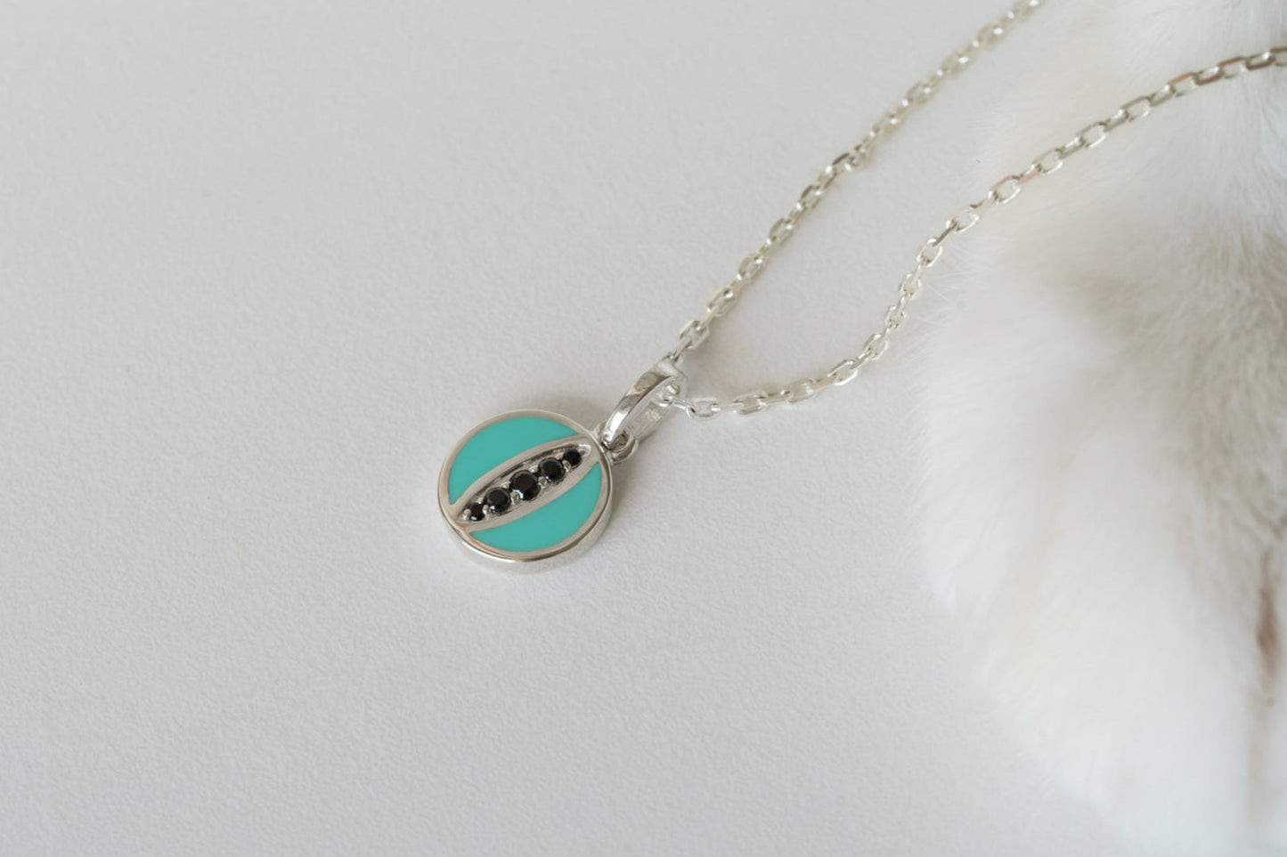 Pendant "Cat's Eye" (9 mm) with emerald enamel and black stones