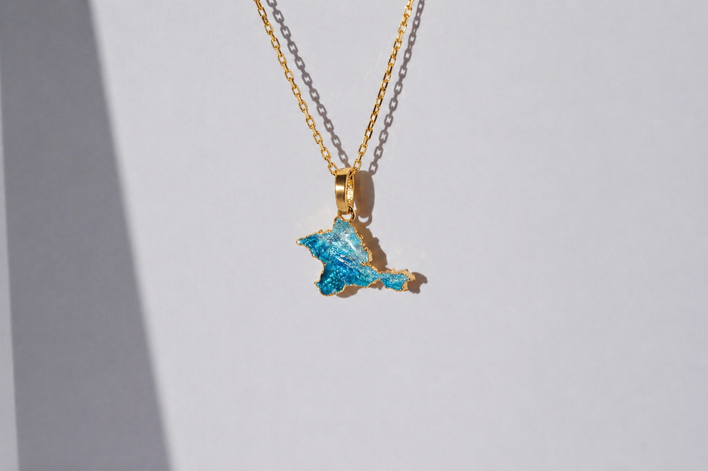 Pendant "Ukrainian Peninsula" textured with emerald enamel