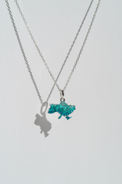 Pendant "United" textured with emerald enamel